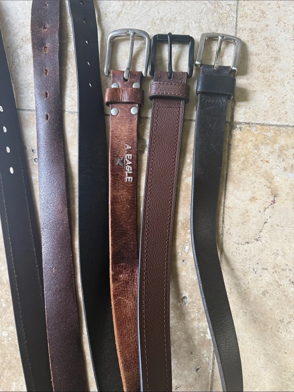 Men’s leather belts (3)  one American Eagle, one dickies and one no brand all 38